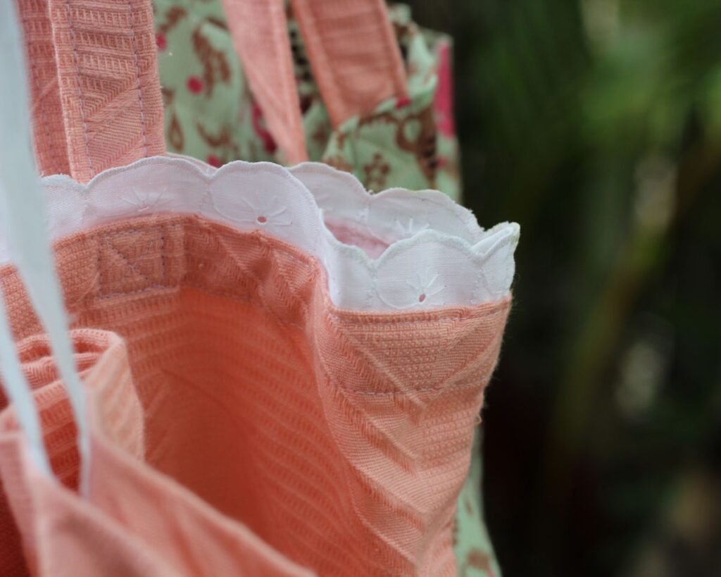 A close up of decorative detailing on this handmade shoulder tote.