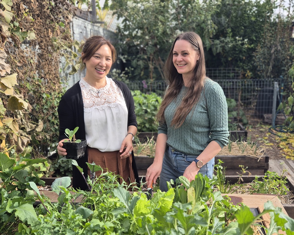 Physio and acupuncturist Dr Karen Chan with Koren Helbig - in front of a raised garden bed that helps prevent bending